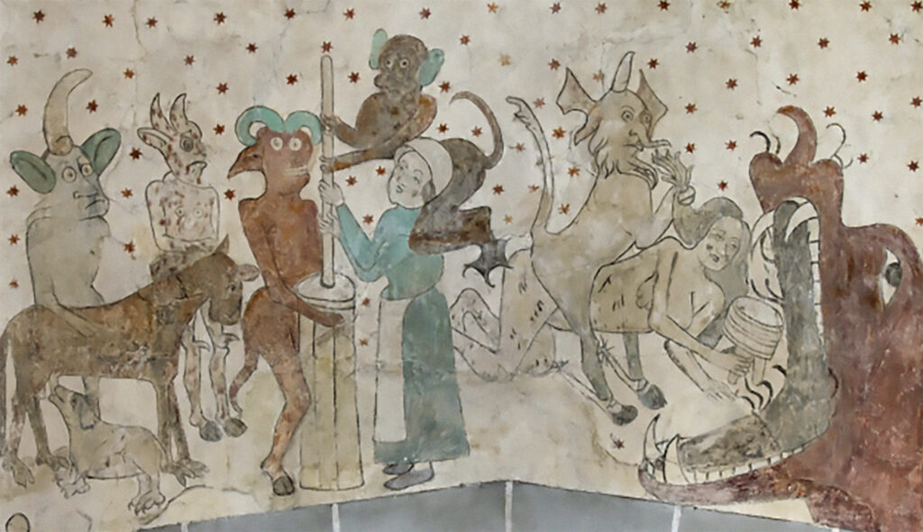 Väggmålning från Öja kyrka. Djävjar hjälper en kvinna att mjälka och kastar en annan kvinna i munnen på ett odjur.